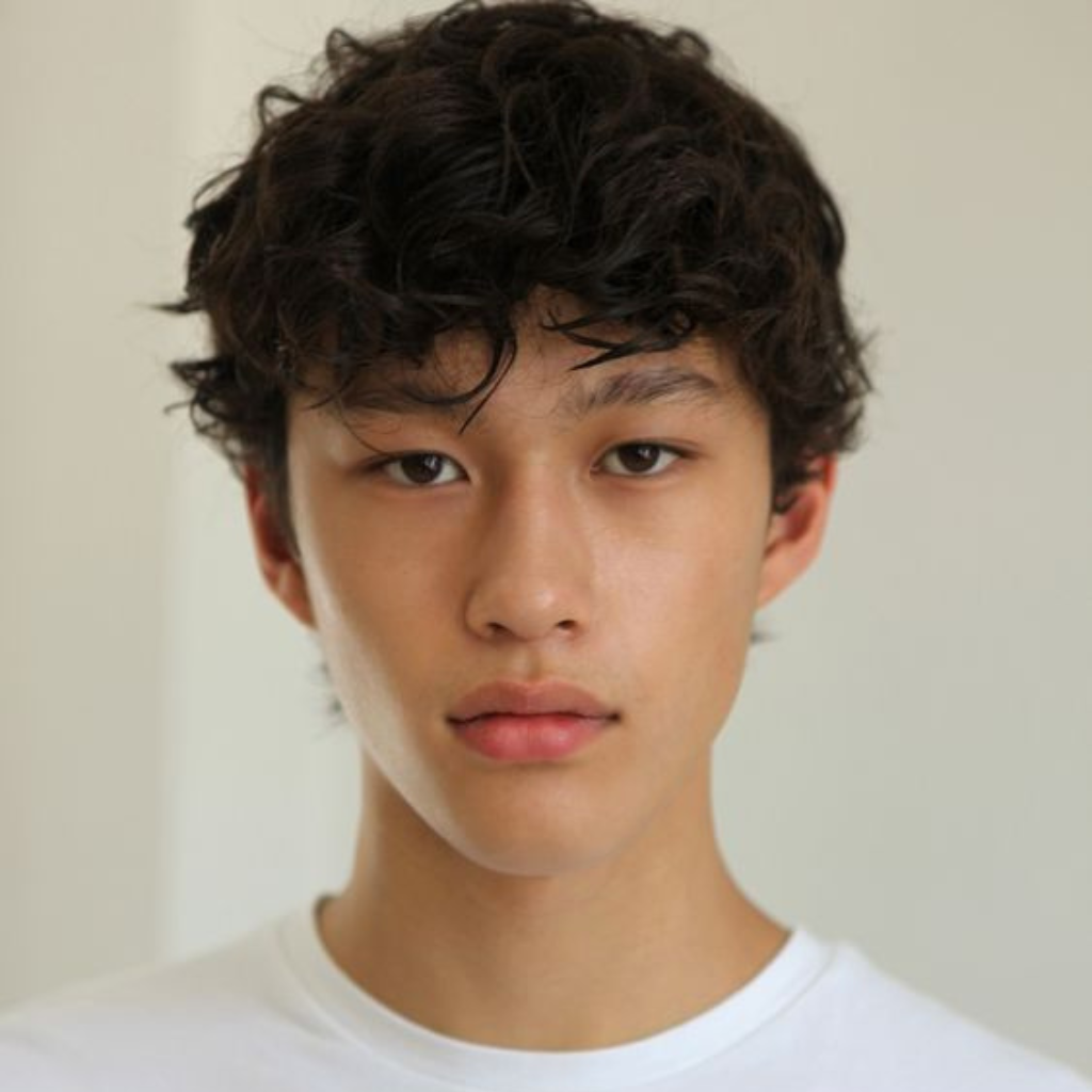 Wavy shag mullet haircut for men with layered texture